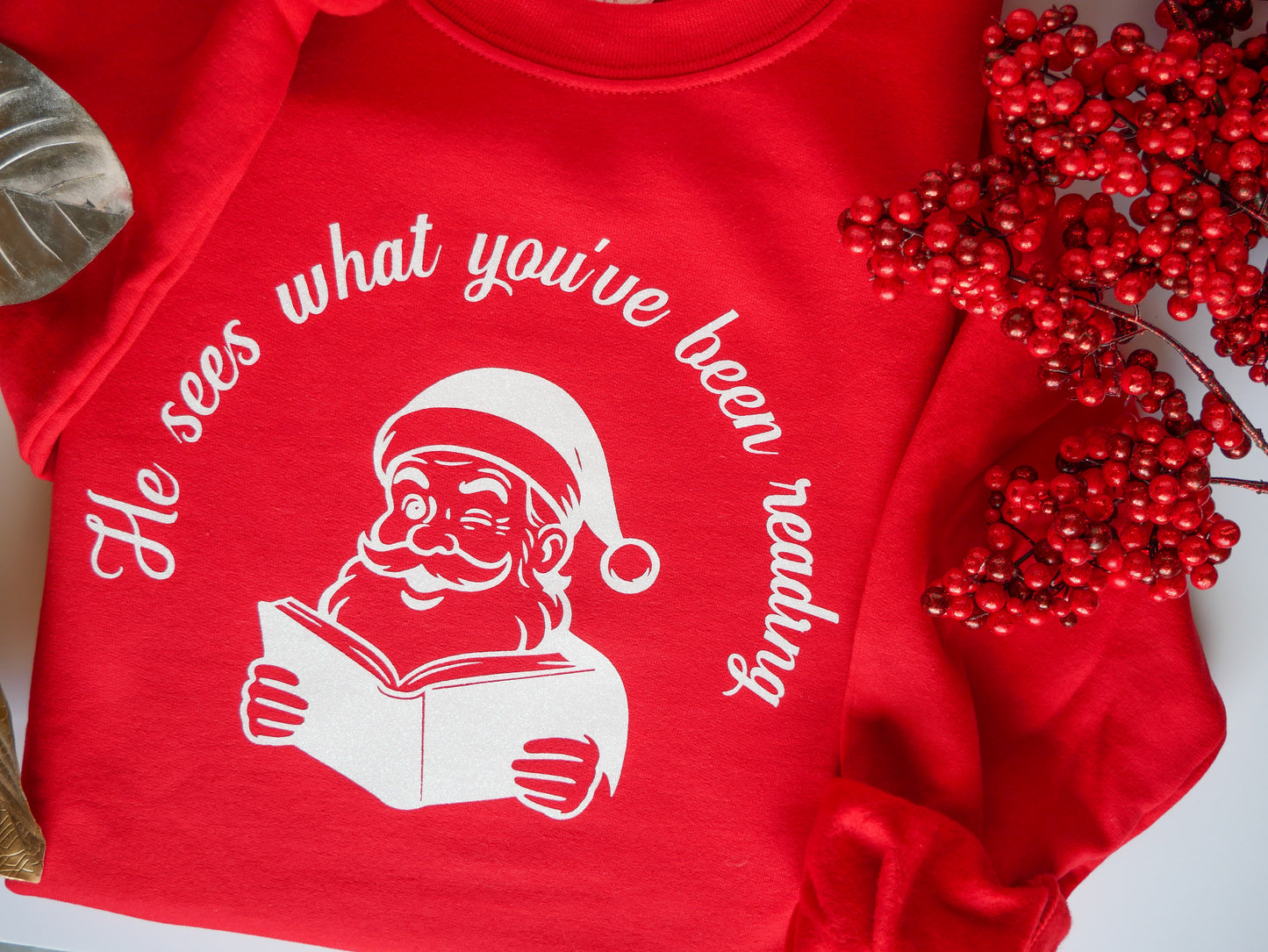 He Sees What You’ve Been Reading - Santa Reading Graphic, Red Funny Christmas Sweatshirt